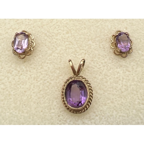 26 - A pair of gold & amethyst set stud earrings together with an oval amethyst set 9ct gold pendant. Hal... 