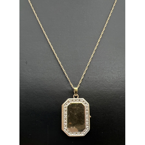 36 - A rectangular shaped 9ct gold locket with small stone mount detail to edges (no stones). On an 18