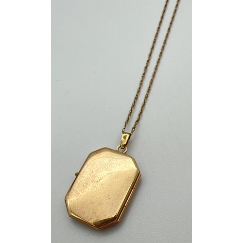 36 - A rectangular shaped 9ct gold locket with small stone mount detail to edges (no stones). On an 18