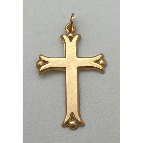 52 - A 9ct gold cross shaped pendant with ball detail to each point. Bale marked 375. Approx. 3.5cm x 2cm... 