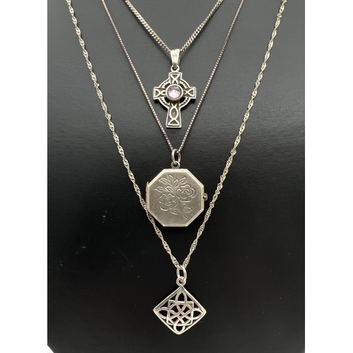 70 - 3 silver and white metal pendant necklaces. An 18