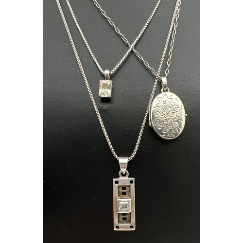 81 - 3 silver pendant necklaces. A square cut clear stone pendant on a 16