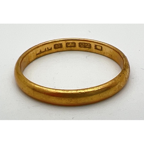 83 - A 22ct gold 3mm wide wedding band. Full hallmarks inside band. Size R½. Weight approx. 3.6g.