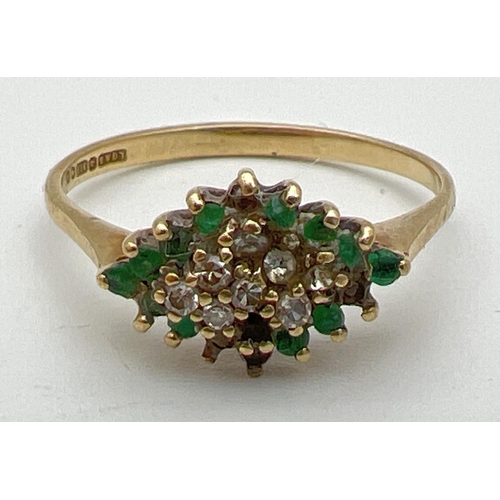 84 - A 9ct gold, emerald and diamond set dress ring. Diamond shaped mount set with small round cut diamon... 