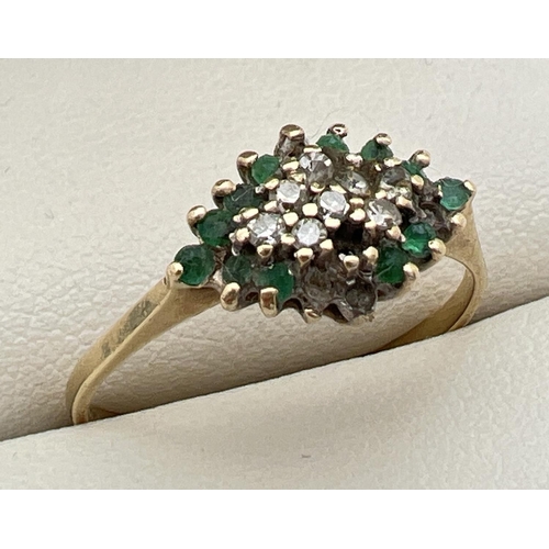 84 - A 9ct gold, emerald and diamond set dress ring. Diamond shaped mount set with small round cut diamon... 