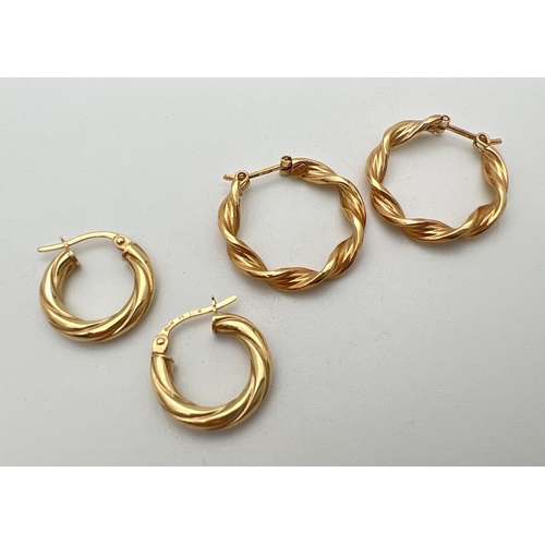 91 - 2 pairs of 9ct gold twist design hoop earrings. Gold marks to posts. Largest approx. 2.25cm diameter... 