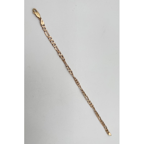 92 - A 7.5 inch Figaro chain bracelet with lobster claw clasp. Gold marks to fixings and clasp. Total wei... 