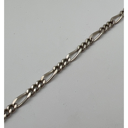 117 - An 8.5 inch Figaro chain bracelet with spring ring clasp. Silver marks to clasp. Total weight approx... 