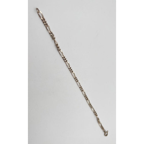 117 - An 8.5 inch Figaro chain bracelet with spring ring clasp. Silver marks to clasp. Total weight approx... 