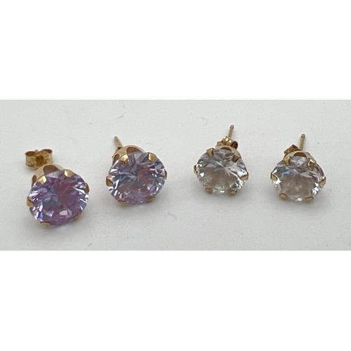 159 - 2 pairs of 9ct gold crystal stone set earrings. A clear pair and a lavender colour pair. Gold marks ... 