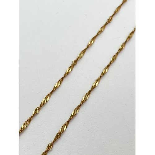 163 - A 24 inch 9ct gold Singapore style chain necklace with spring ring clasp. Gold marks to fixings and ... 