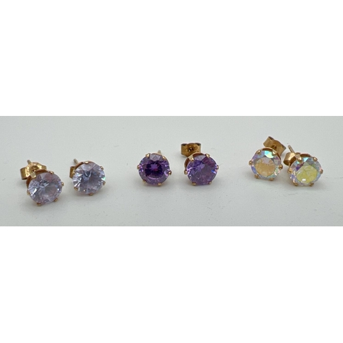 174 - 3 pairs of 9ct gold crystal set earrings. Set with iridescent stones, pale lilac stones and purple s... 