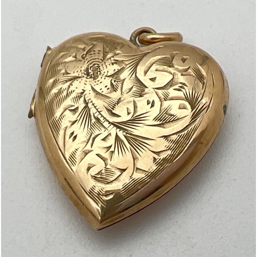 175 - A vintage 9ct gold heart shaped locket with front floral & scroll engraved decoration. Inscription a... 