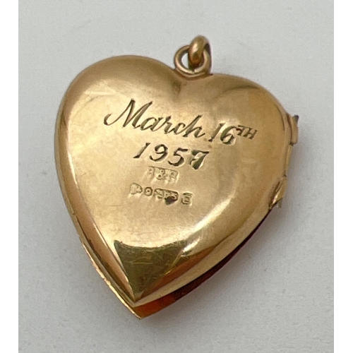 175 - A vintage 9ct gold heart shaped locket with front floral & scroll engraved decoration. Inscription a... 