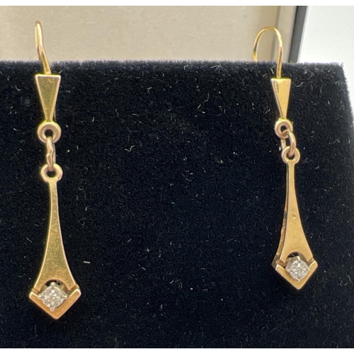 178 - A pair of 9ct gold lever back drop style earrings set with a small round cut diamond. Gold marks to ... 