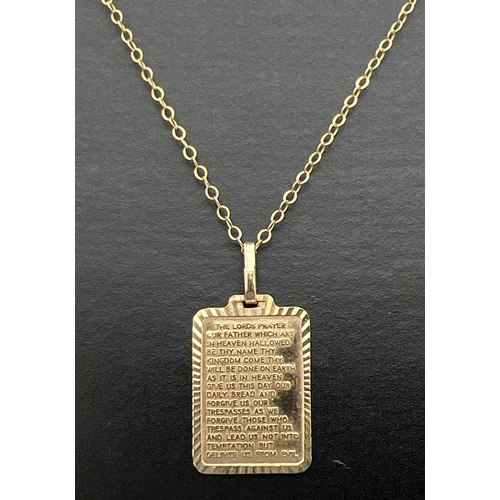 181 - An unmarked gold Lords Prayer square shaped pendant, on a 16