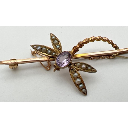 183 - A vintage 9ct gold gem set dragonfly bar brooch with safety chain. Oval cut amethyst set to body wit... 