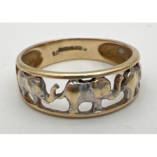 187 - A 9ct white and yellow gold pierced work elephant band ring. Full hallmarks to inside of band. Size ... 