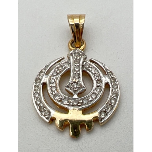 194 - A 14ct gold Khanda pendant set with 0.34ct of small round cut diamonds. Gold and diamond marks to ba... 