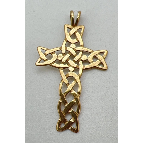 198 - A 9ct gold pierced work Celtic knot cross shaped pendant with fixed bale. Hallmarks to reverse. Appr... 