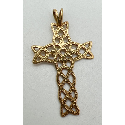 198 - A 9ct gold pierced work Celtic knot cross shaped pendant with fixed bale. Hallmarks to reverse. Appr... 