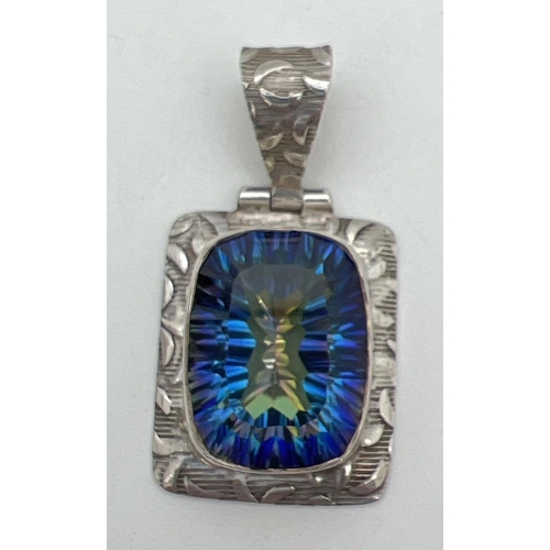 203 - A silver pendant set with a large square cut mystic topaz stone. Detailed pattern to mount and bale.... 