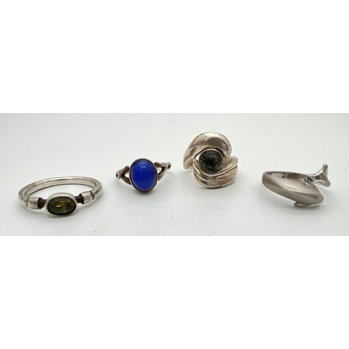 223 - 4 silver dress rings. To include dolphin ring and 2 labradorite set rings. Silver marks to all bands... 