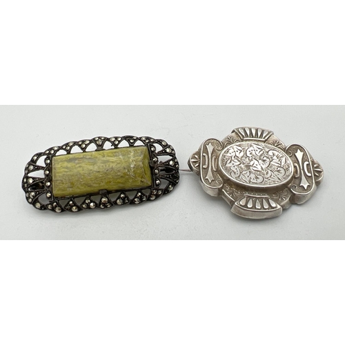 228 - 2 vintage brooches. A white metal Victorian brooch with floral engraved detail and safety chain bale... 