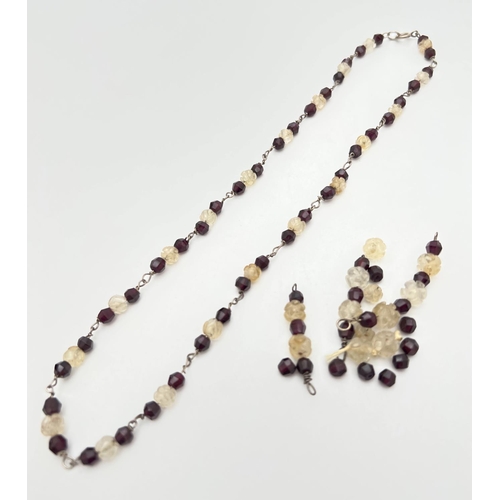 230 - A vintage 17 inch garnet and carved clear stone necklace with extra beads and silver spring ring cla... 