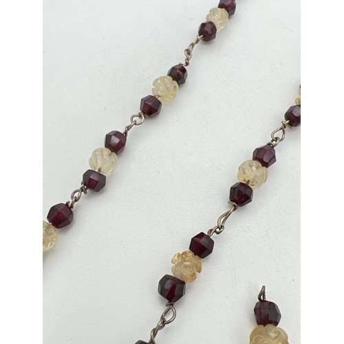 230 - A vintage 17 inch garnet and carved clear stone necklace with extra beads and silver spring ring cla... 