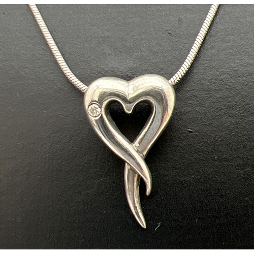 231 - A Hot Diamonds silver heart shaped pendant necklace. Open heart, set with small diamond, on a 16