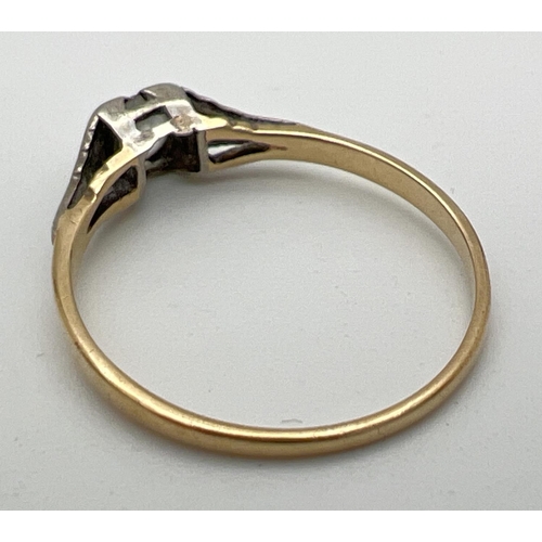 253 - A vintage 9ct gold solitaire ring set with a round cut white topaz stone in a square shaped mount. E... 