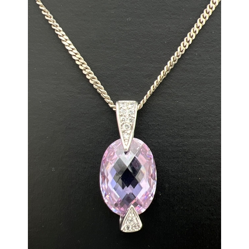 260 - A 925 silver pendant set with a large oval cut checker board lilac tourmaline. Pendant base and bale... 