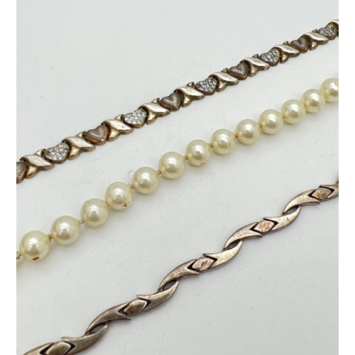 265 - 3 bracelets to include silver. A faux pearl with silver push clasp, a hearts and kisses bracelet mar... 