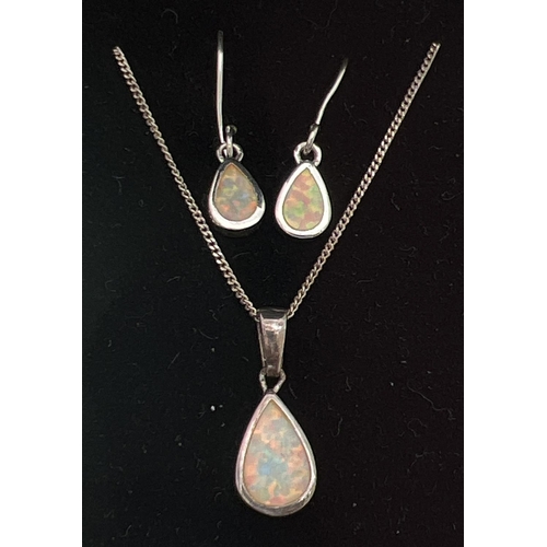 269 - A teardrop shaped silver opalite set pendant necklace and  matching earrings. Pendant on a 16