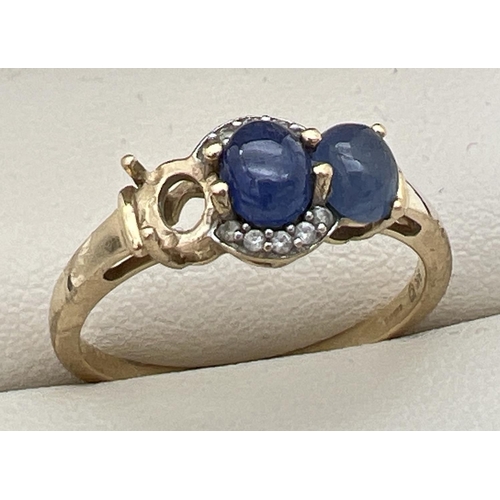 272 - A 9ct gold, sapphire and diamond dress ring. Originally set with 3 sapphire cabochon stones, 1 now m... 