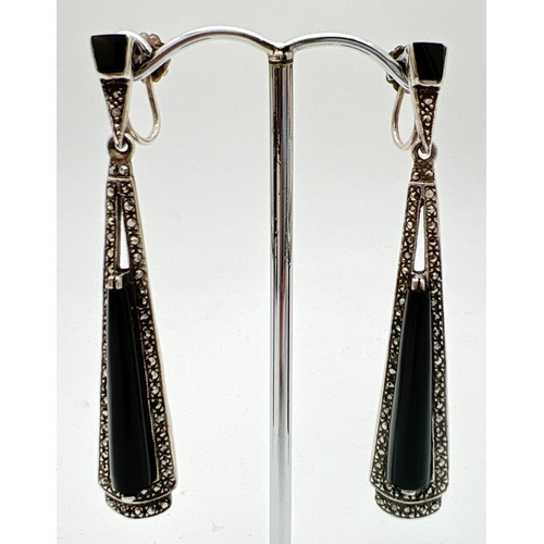 276 - A pair of silver Art Deco style, screw back drop earrings, set with black onyx and marcasite stones.... 