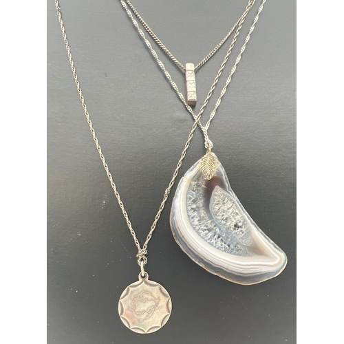 280 - 3 silver pendant necklaces. An agate slice on a singapore style chain, a pisces circular shaped pend... 