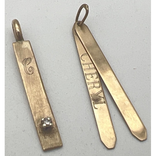 285 - 2 9ct gold pendants. A double bar pendant with 