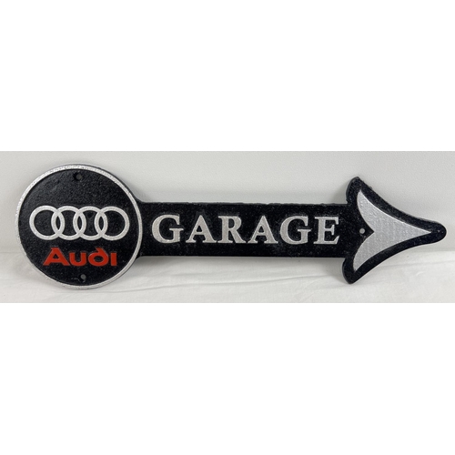 1247 - A cast iron Audi Garage wall arrow sign, painted black, silver & red. Approx. 44cm long.