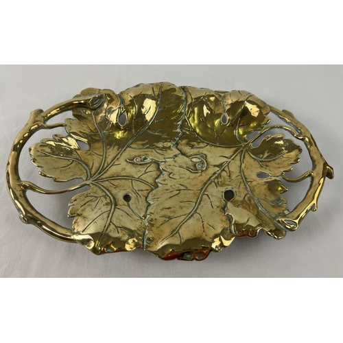 1140 - A brass Art Nouveau design shallow bowl modelled as vine leaves with pierced detail to handles. Rais... 