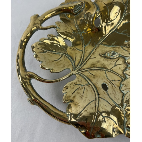 1140 - A brass Art Nouveau design shallow bowl modelled as vine leaves with pierced detail to handles. Rais... 