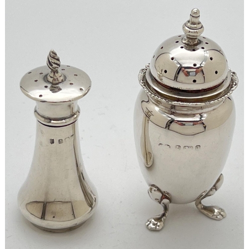 1119 - 2 early 20th century silver pepperettes. An Edwardian silver pepperette with twisted design finial, ... 