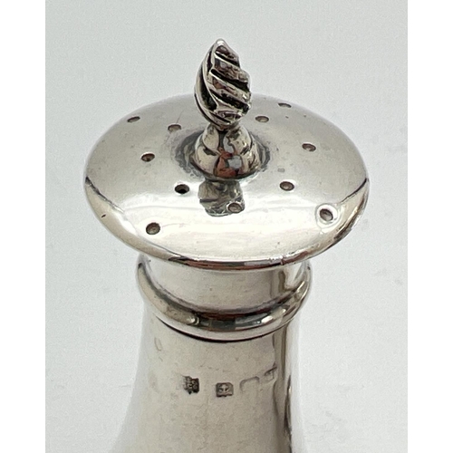 1119 - 2 early 20th century silver pepperettes. An Edwardian silver pepperette with twisted design finial, ... 