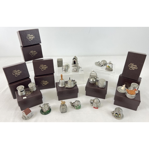 1259 - A collection of 20 pewter Thimble Collectors Club novelty thimbles, some boxed. Each thimble with a ... 