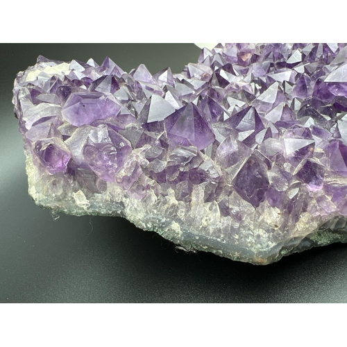 1267 - A large 3.7kg natural amethyst cluster geode with varying sized points. Approx. 23cm x 20cm at wides... 