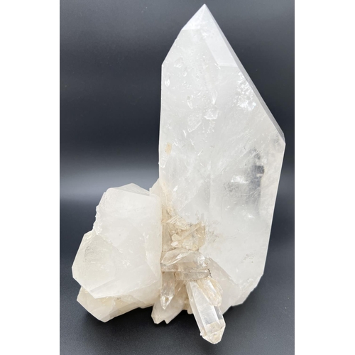 1271 - A large clear crystal quartz wand with multiple cluster detail. Natural white, black and orange colo... 