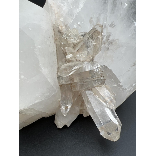 1271 - A large clear crystal quartz wand with multiple cluster detail. Natural white, black and orange colo... 