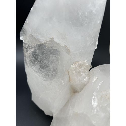 1271 - A large clear crystal quartz wand with multiple cluster detail. Natural white, black and orange colo... 