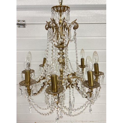 1272 - A vintage 8 arm brass and crystal chandelier ceiling pendant, with electrical wiring. Crystal drops ... 